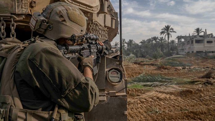 An Israeli soldier operates in the Gaza Strip amid the ongoing conflict between Israel and the Palestinian Islamist group Hamas | Israel Defense Forces/Handout via Reuters