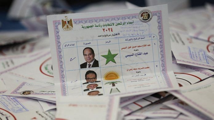 A ballot is seen as election officials count them inside a school used as a polling station and a counting centre, during the presidential election in Cairo, Egypt, December 12, 2023 | Reuters