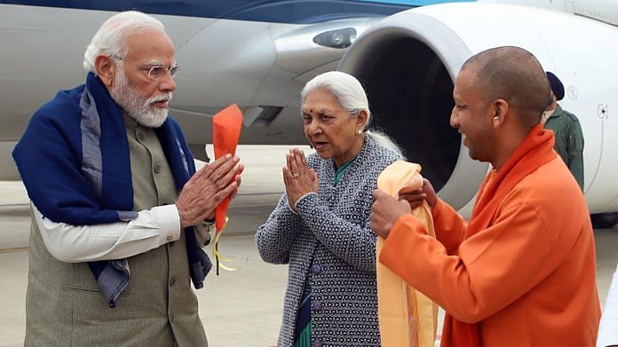 Prime Minister Narendra Modi receives a warm welcome from Uttar Pradesh Governor Anandiben Patel and Chief Minister Yogi Adityanath as he arrives to inaugurate the Maharishi Valmiki International Airport, Ayodhya Dham, in Ayodhya on Saturday. (ANI Photo)