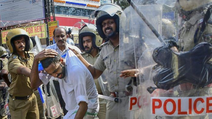 Police personnel detain KSU activists during their protest march to the Police Headquarters against alleged attacks by police on activists of the Youth Congress and the Kerala Students Union, in Thiruvananthapuram, Thursday, Dec. 21, 2023. (PTI Photo)