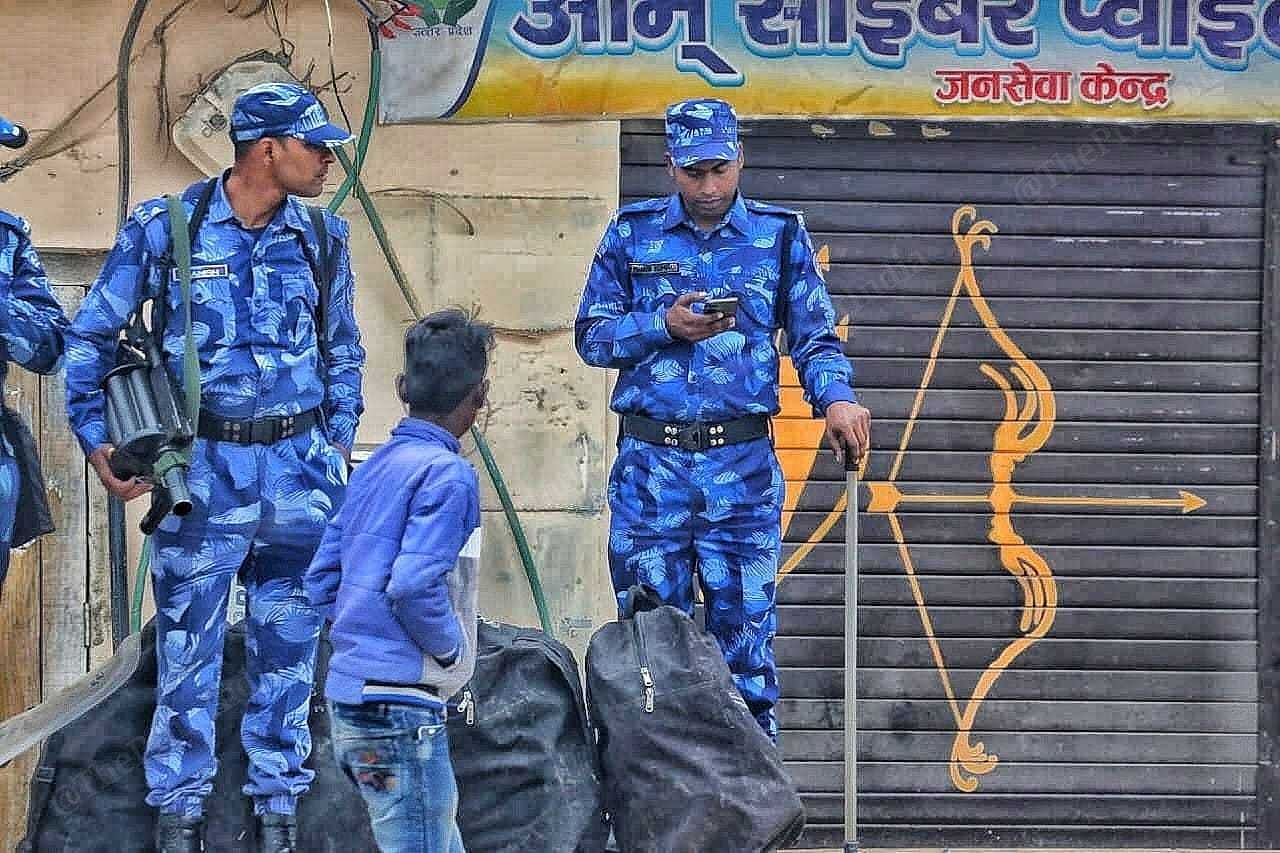 Rapid Action Force prsonnel standing guard ahead of the inauguration of Ayodhya's airport and redeveloped railway station | Praveen Jain | ThePrint 