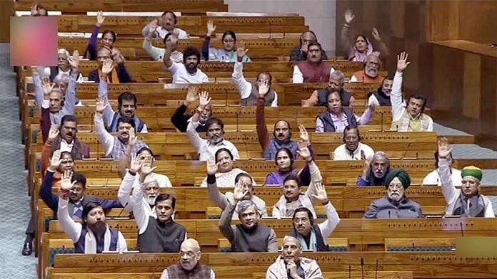 Lok Sabha MPs give voice vote on Bharatiya Nyaya Sanhita Bill during the winter session of Parliament, in New Delhi Wednesday. ANI/Sansad TV