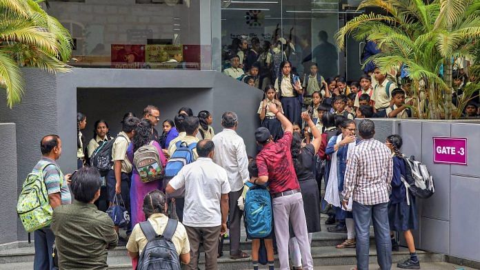 Commotion at a school after at least 15 private schools received an email with a bomb threat on its premises, triggering panic among the staff and parents in Bengaluru, on 1 Dec 2023 | PTI