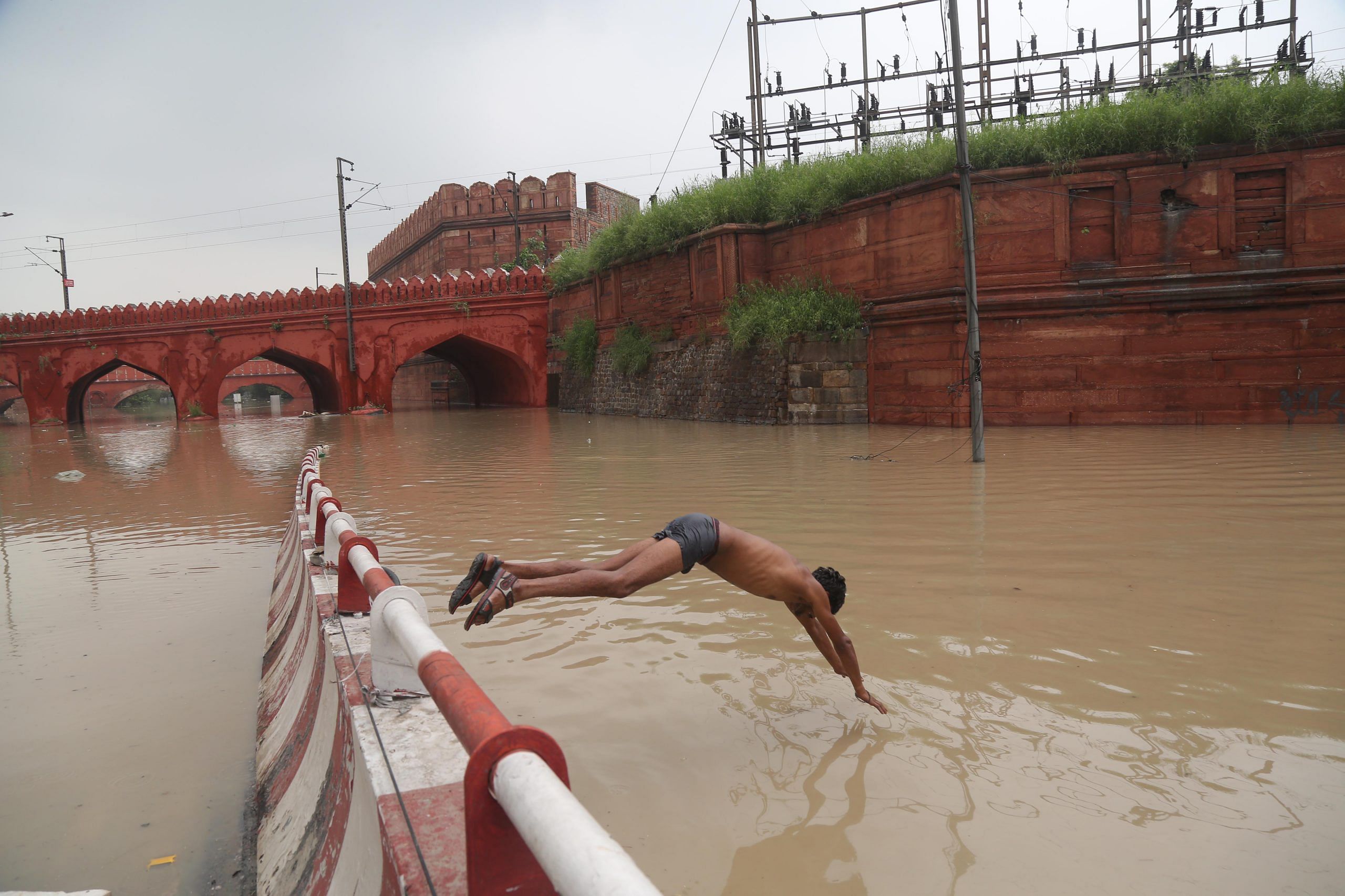 The flooded Yamuna in the national capital this year brought misery to many, who found their houses submerged. For this youth near Delhi's iconic Red Fort, however, the gushing water was perfect for a swim. It is this conflicting play of emotions that make this a memorable image for me this year | Photo: Suraj Singh Bisht | ThePrint