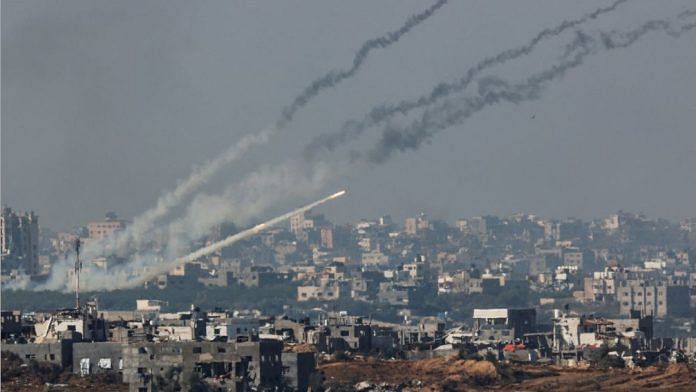 Rockets are launched from the Gaza Strip into Israel, after a temporary truce expired between Israel and the Palestinian Islamist group Hamas, as seen from Israel's border with Gaza in southern Israel, on 1 Dec 2023 | Reuters