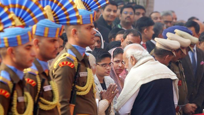 Prime Minister Narendra Modi meets the family members of those who lost their lives in the 2001 Parliament attack, during a tribute ceremony at Samvidhan Sadan | Praveen Jain | ThePrint