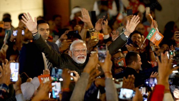 Prime Minister Narendra Modi arrives at the BJP headquarters in New Delhi after the party's victories in Rajasthan, Madhya Pradesh and Chhattisgarh | Suraj Singh Bisht | ThePrint