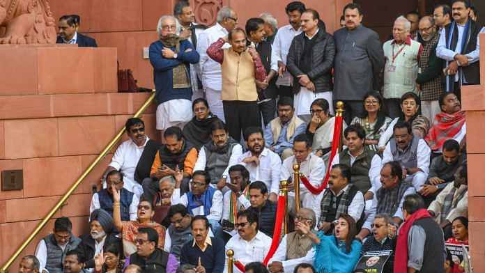 Suspended Opposition MPs stage a protest at the Makar Dwar after the suspension of 92 MPs for the remainder of the ongoing winter session of Parliament, in New Delhi on Tuesday, 19 December | ANI