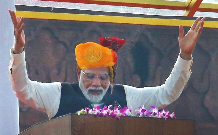 It's Prime Minister Narendra Modi's bowed head and wide open arms that is the USP of this image for me. He is every bit the humble, common-man leader here as he addresses the masses on Independence Day | Photo: Praveen Jain | ThePrint