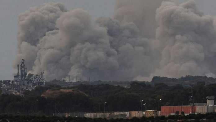 Smoke rises over Gaza, amid the ongoing conflict between Israel and the Palestinian Islamist group Hamas, as seen from southern Israel, December 8, 2023. REUTERS/Athit Perawongmetha