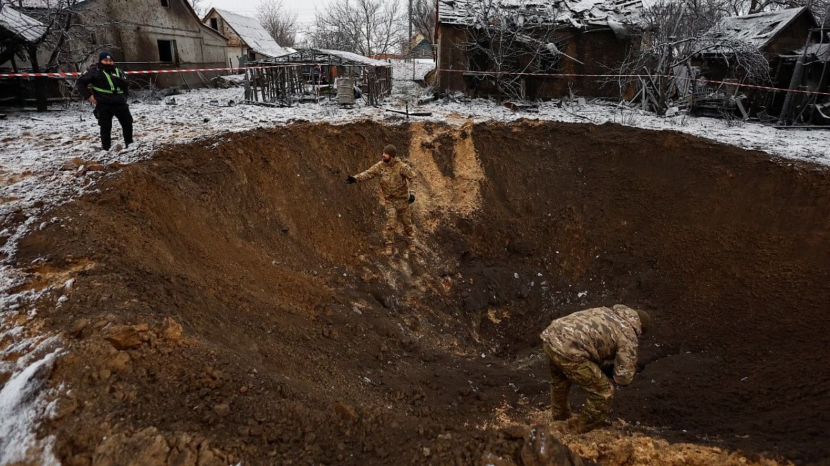 Crater that appeared during Russian strike in Kyiv, Dec 11, 2023 | Valentyn Ogirenko/Reuters