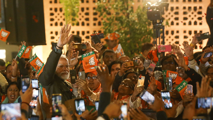 Prime Minister Narendra Modi waves at supporters at the BJP headquaters in New Delhi | Suraj Singh Bisht | ThePrint