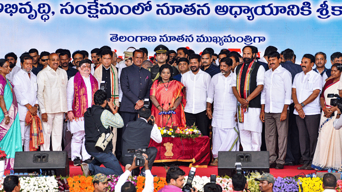 Telangana Governor Tamilisai Soundararajan with newly sworn-in CM A. Revanth Reddy, Deputy CM Mallu Bhatti Vikramarka and other ministers at LB Satdium in Hyderabad, Thursday | PTI