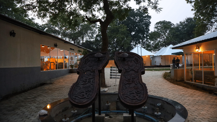 'Ram padukas' at the entry of Ayodhya tent city. There are 35 tents in the vicinity | Manisha Mondal | ThePrint