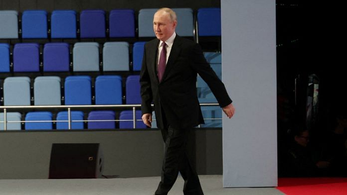 Russian President Vladimir Putin arrives to deliver a speech during the 4th Railway Congress at the Luzhniki Olympic Complex in Moscow, Russia | Reuters