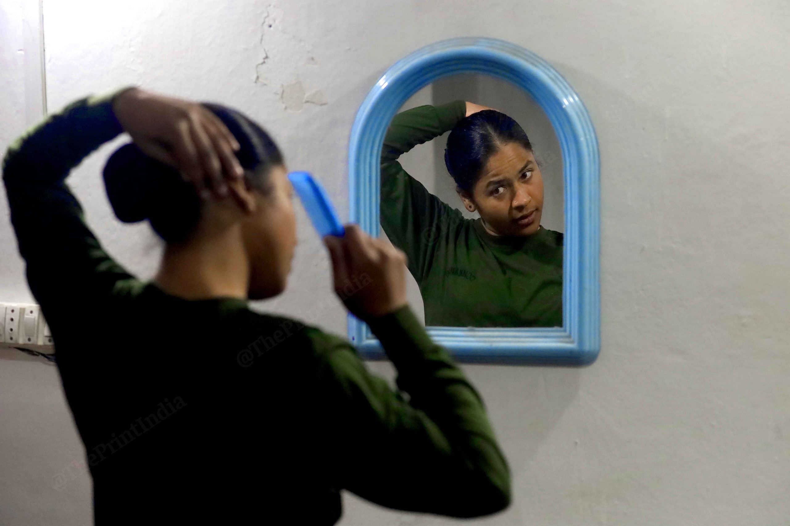 A woman CRPF jawan prepares for an assignment. These women strike a delicate balance every day — playing daughter, wife, mother, and a jawan. It is the confidence with which they perform these roles that makes this a special click for me | Photo: Manisha Mondal | ThePrint