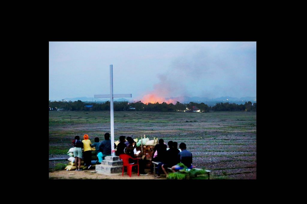 A group of Kuki villagers watch their homes go up in flames in the distance during this year's Kuki-Meitei ethnic conflict in Manipur. The heartbreak and desolation in this image symbolises for me the death, injury, assault and displacement suffered by members of both the tribal Kuki-Zo community and non-tribal Meiteis during the conflict | Photo: Suraj Singh Bisht | ThePrint