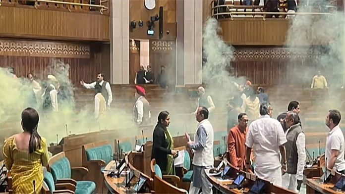 Scenes at the Lok Sabha after two men caused a ruckus using coloured smoke during the winter session of Parliament, in New Delhi Wednesday | ANI Photo/India TV