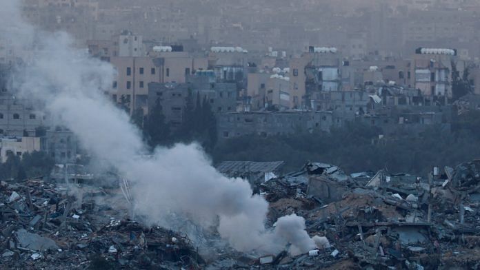 Smoke rises over Gaza, amid the ongoing conflict between Israel and the Palestinian Islamist group Hamas, as seen from southern Israel, December 24, 2023 | Reuters