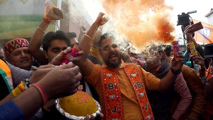 BJP supporters celebrate after the party's victory in the Madhya Pradesh, Rajasthan and Chhattisgarh assembly elections | Suraj Singh Bisht | ThePrint