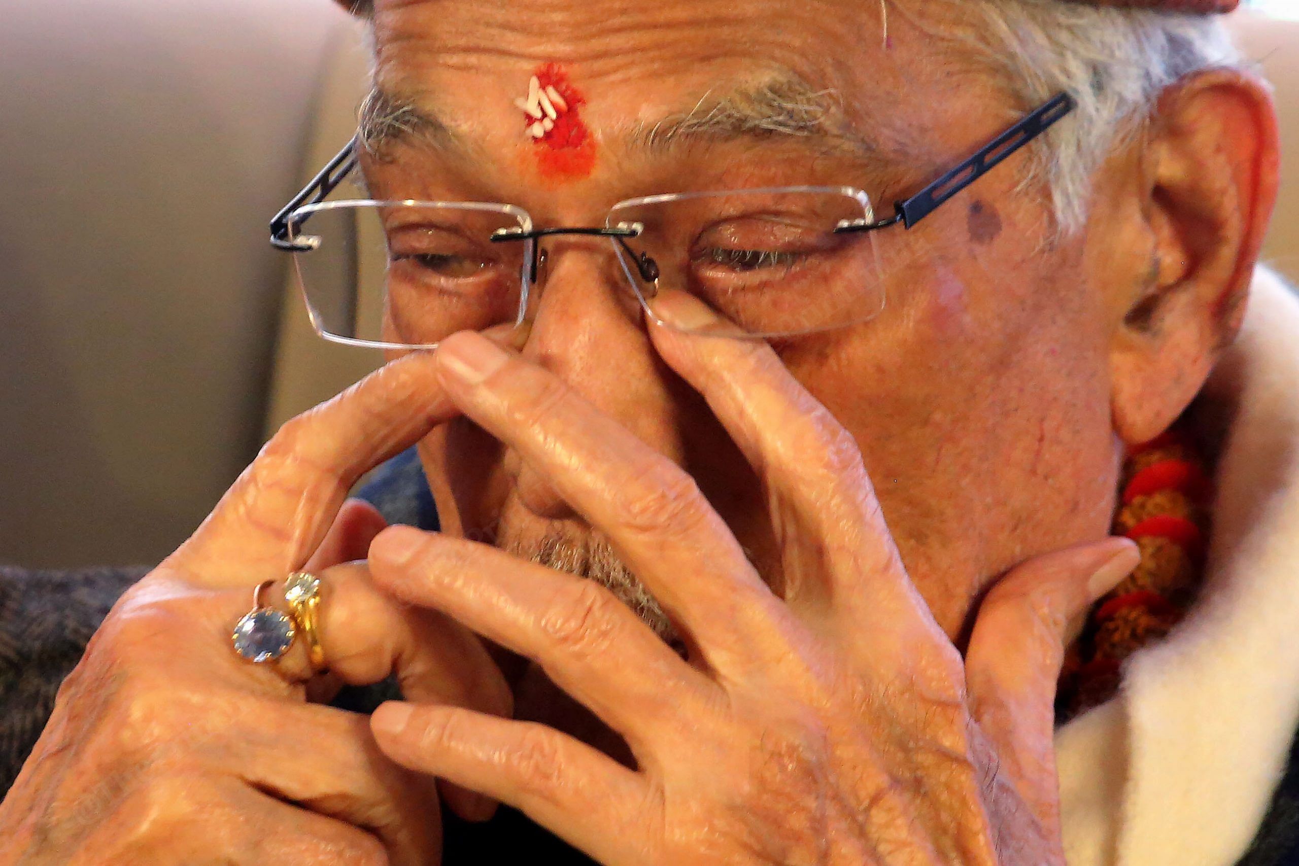 An emotional Joshi wiping away tears | Praveen Jain | ThePrint
