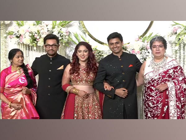 Aamir Khan poses with newlyweds Ira Khan, Nupur Shikhare at wedding reception 