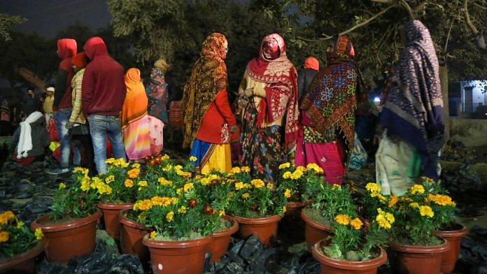 A group of women potting flowers in Ayodhya Saturday | Photo: Suraj Singh Bisht/ThePrint