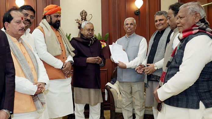 Bihar newly sworn-in Chief Minister Nitish Kumar with Leader of Opposition of State Assembly and BJP leader Vijay Kumar Sinha, party state president Samrat Choudhary with others at Raj Bhavan, in Patna on Sunday | ANI