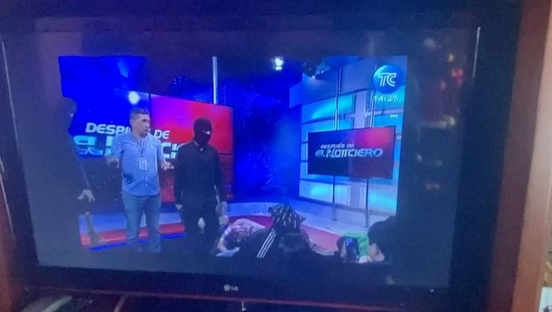 Ecuador TV studio taken over live on air by masked people brandishing