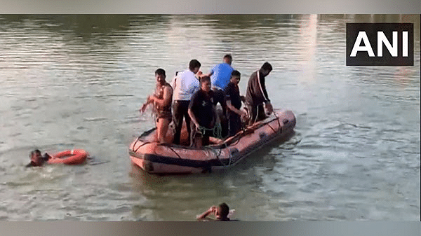 A boat carrying children capsized in Vadodara's Harni Motnath Lake Thursday evening. 10 people have been rescued so far/Photo: ANI