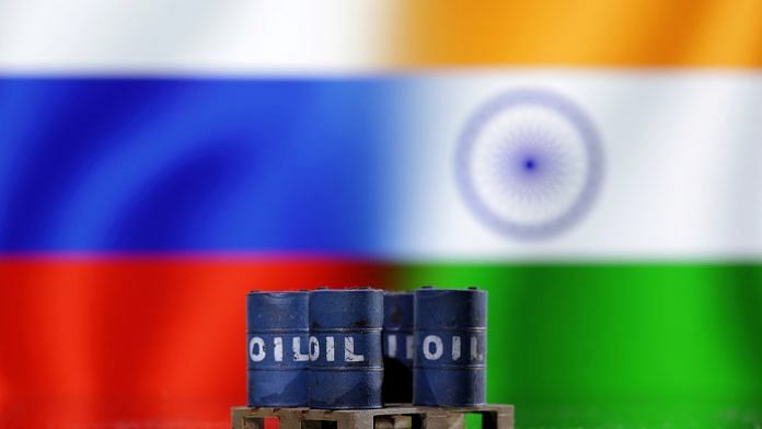 A model of oil barrels is seen in front of Russian and Indian flags in this illustration taken, December 9, 2022 | Reuters