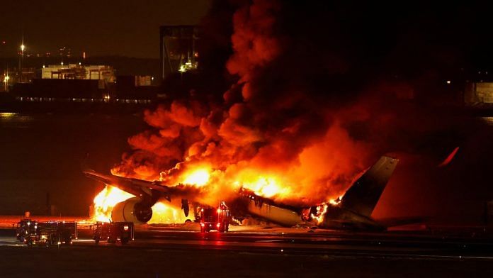 Japan Airlines' A350 airplane is on fire at Haneda international airport in Tokyo, on 2 Jan 2024 | Reuters