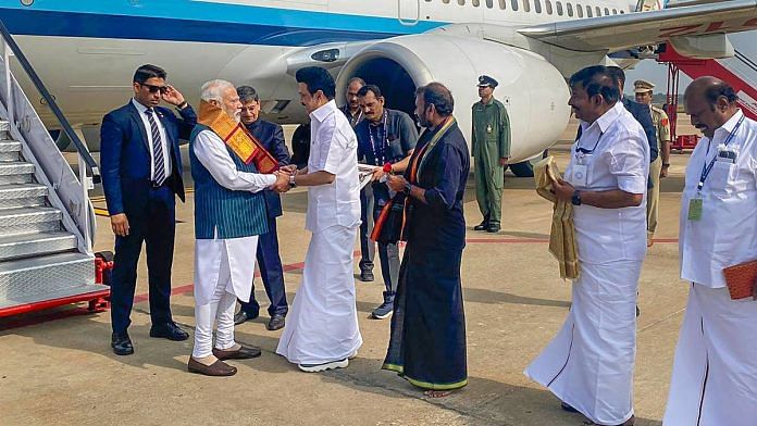 PM Narendra Modi being received by Tamil Nadu CM MK Stalin upon his arrival in Tiruchirappalli, on 2 Jan 2024. Tamil Nadu Governor RN Ravi and Union Minister of State L Murugan are also seen | PTI