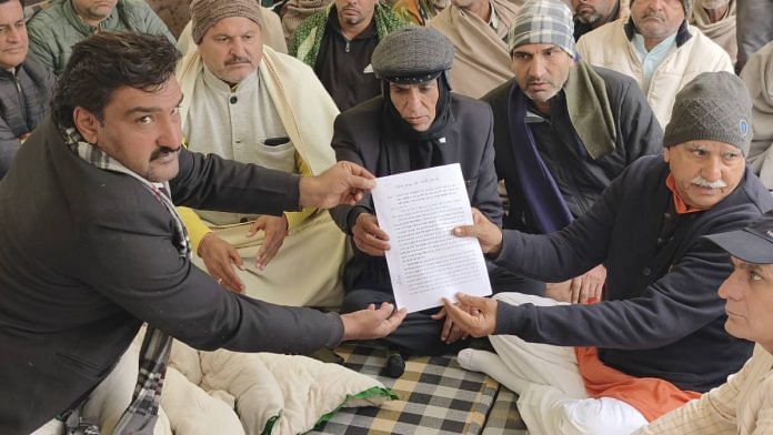 Protesters in Charkhi Dadri hand over a memorandum demanding justice to Bhiwani- Mahendragarh MP Dharambir Singh (right) | Photo: By special arrangement