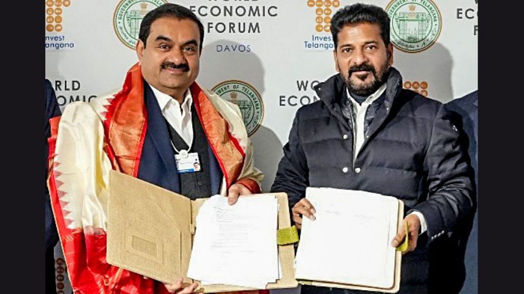 Telangana Chief Minister Revanth Reddy with Gautam Adani, Chairperson Adani Group on the sidelines of World Economic Forum's 54th Annual Meeting, in Davos on Wednesday | ANI