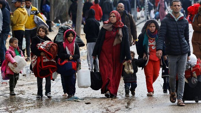 Palestinians fleeing Khan Younis in southern Gaza Strip on 29 Jan 2024 | Reuters/Mohammed Salem