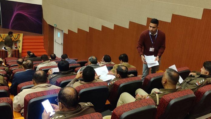 Police officers receive feedback forms after the conclusion of the training session at the Delhi Police Headquarters last week | Photo: Mayank Kumar | ThePrint