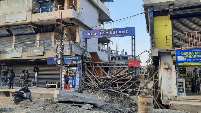 A make-shift barrier at the opening of a road leading to a locality in Imphal East | Sourav Roy Barman | ThePrint