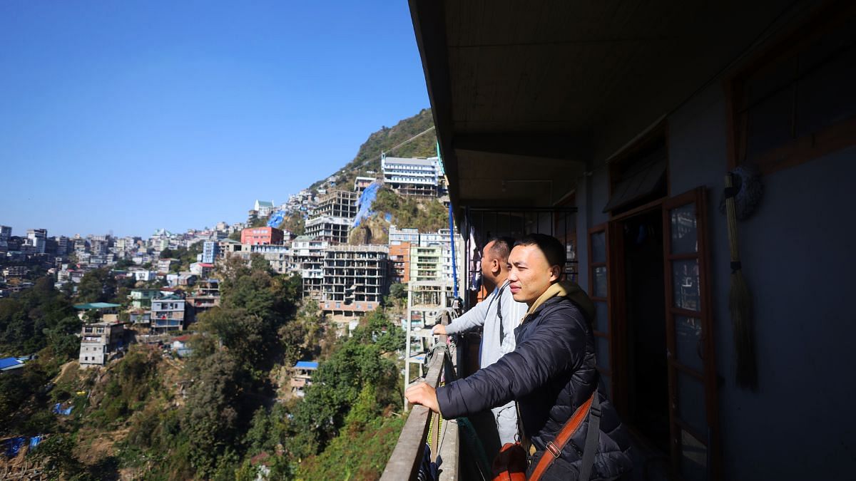 Andrew and Vaiphei look at the Aizawl city | Photo: Manisha Mondal | ThPrint