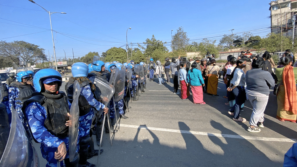 Representative image | Security personnel stand guard as people wait to meet Manipur Chief Minister N. Biren Singh in Imphal amid a spurt in violence | ANI