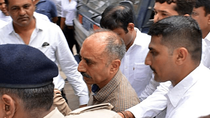 File photo of police escorting former IPS officer Sanjiv Bhatt to a court in Jamnagar in 2019 | ANI