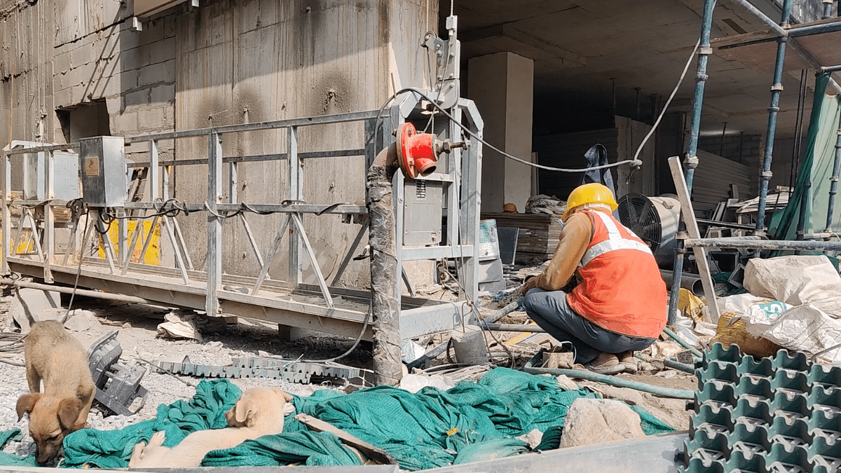 Workers at an ongoing GPRA redevelopment project | Danishmand Khan | ThePrint 