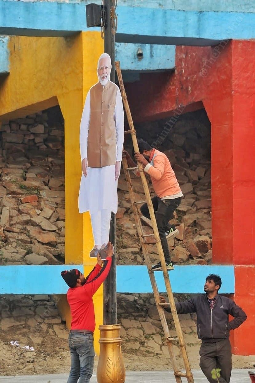 Ahead of Prime Minister Narendra Modi's visit for the pran pratishtha ceremony, a cut-out of the PM being placed in the city | Photo: Praveen Jain | ThePrint