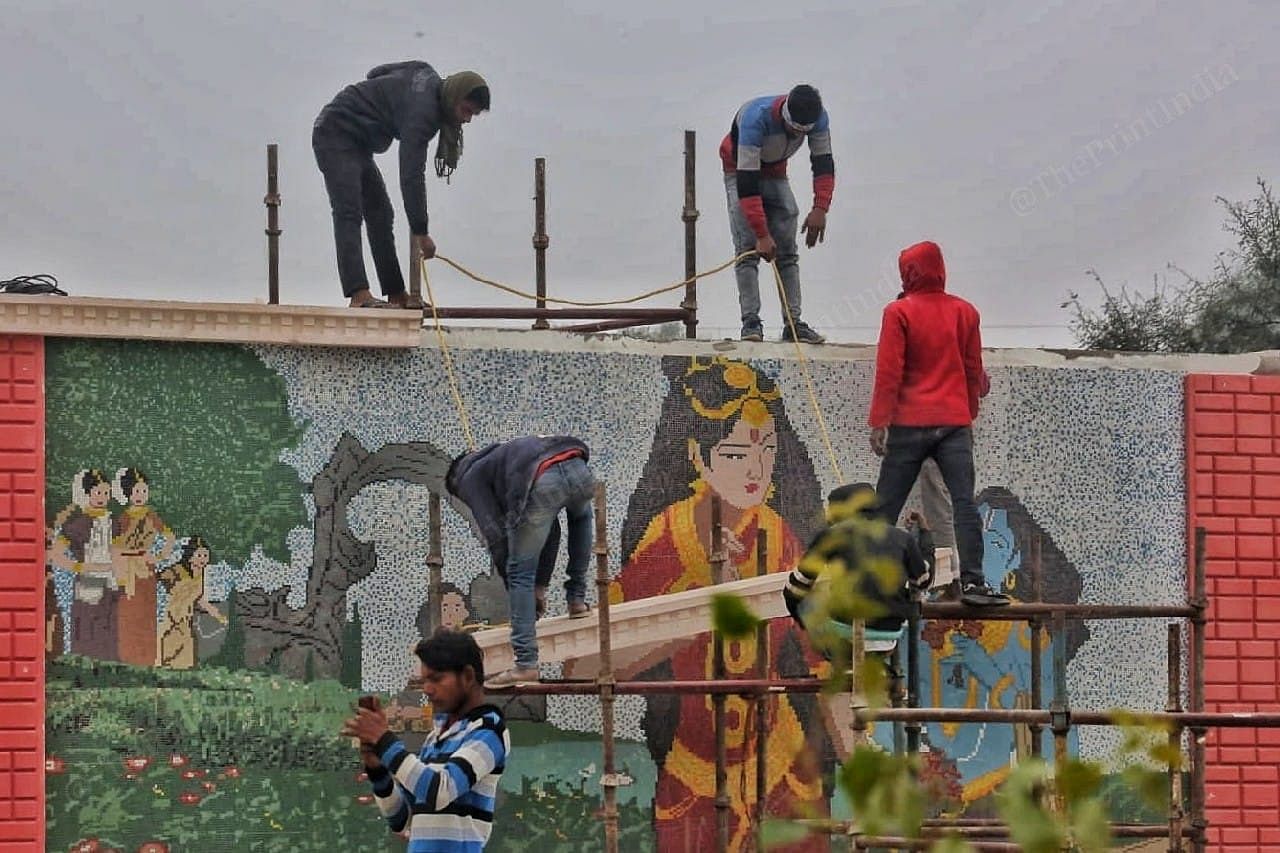 Workers prepare the city for the pran pratishtha ceremony |Photo: Praveen Jain | ThePrint