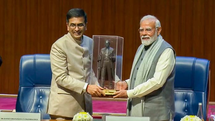 Prime Minister Narendra Modi being presented a memento by Chief Justice of India Justice D.Y. Chandrachud during the 75th year celebrations of the Supreme Court of India, in New Delhi, Sunday, Jan. 28, 2024 | PTI