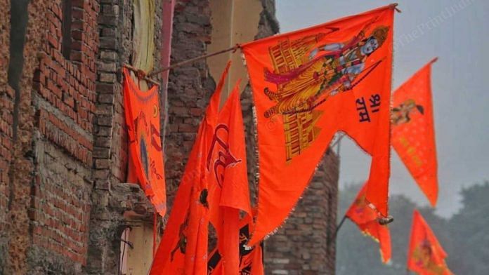 Flags with Lord Ram pictures stuck on walls of building in Ayodhya | ThePrint Photo | Praveen Jain