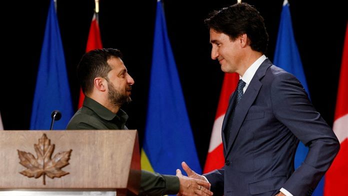 Ukraine's President Volodymyr Zelenskiy shakes hands with Canadian Prime Minister Justin Trudeau, as they attend a joint press conference, in Ottawa, Ontario, Canada September 22, 2023 | Reuters