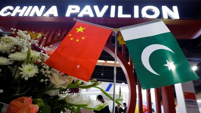 Flags of Pakistan and China are seen at the entrance of the China Pavilion, during the International Defence Exhibition and Seminar 