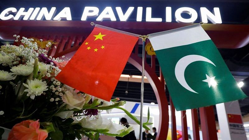Flags of Pakistan and China are seen at the entrance of the China Pavilion, during the International Defence Exhibition and Seminar "IDEAS 2022" in Karachi, Pakistan November 16, 2022. REUTERS/Akhtar Soomro