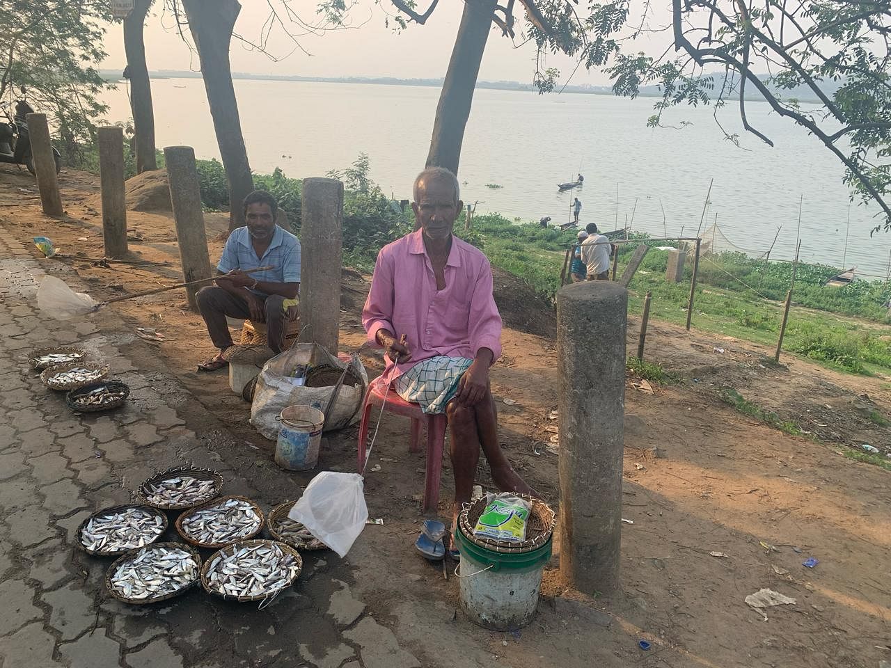 A local fisherman selling baskets of freshwater fish. Indian river shad (Karoti in Assamese) and swamp barb (Puthi) are sold for Rs 100 for half a kilo | Karishma Hasnat | ThePribt 